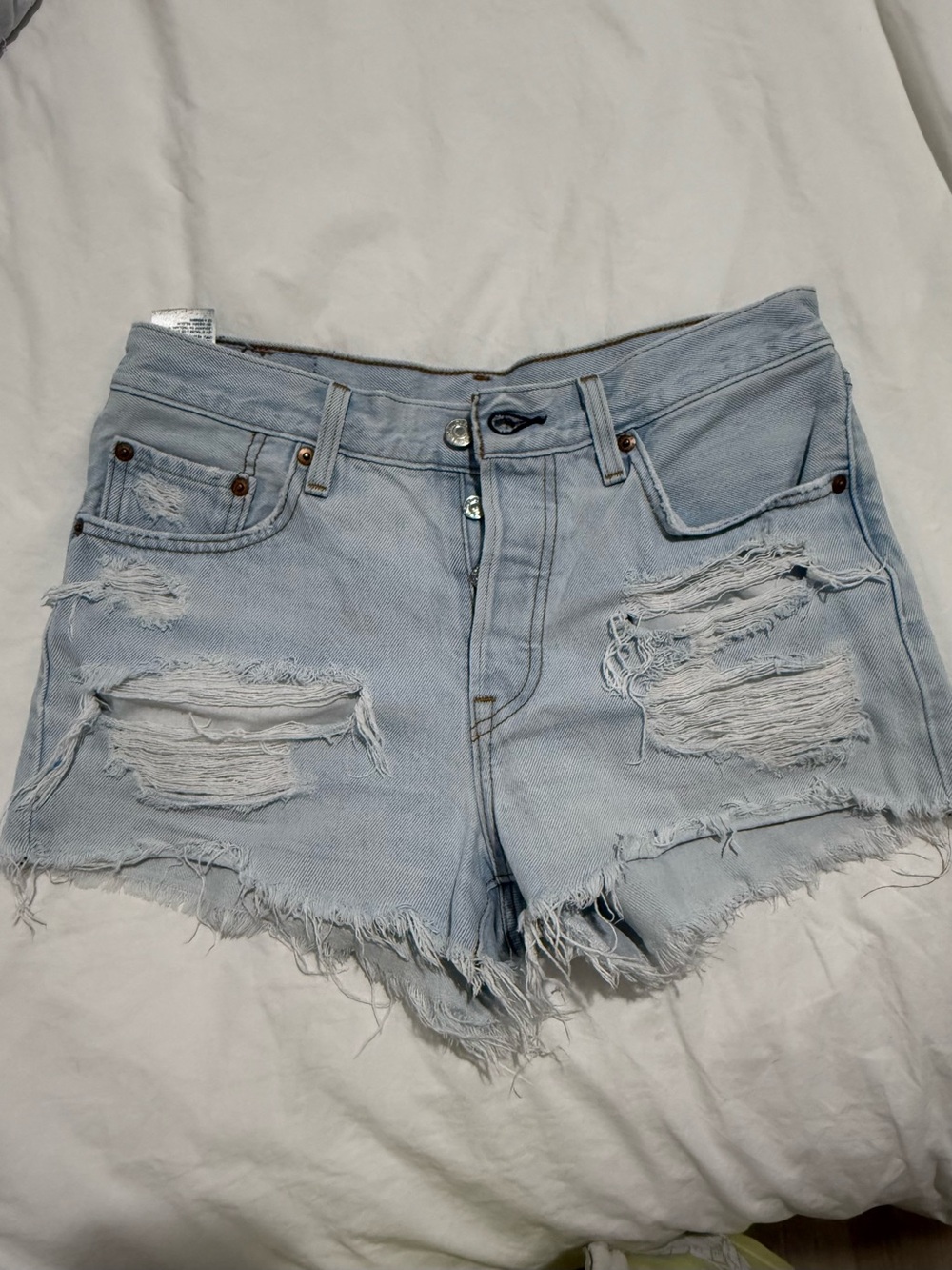 Vintage Levi's Light Blue Distressed Cutoff Denim Shorts size 27